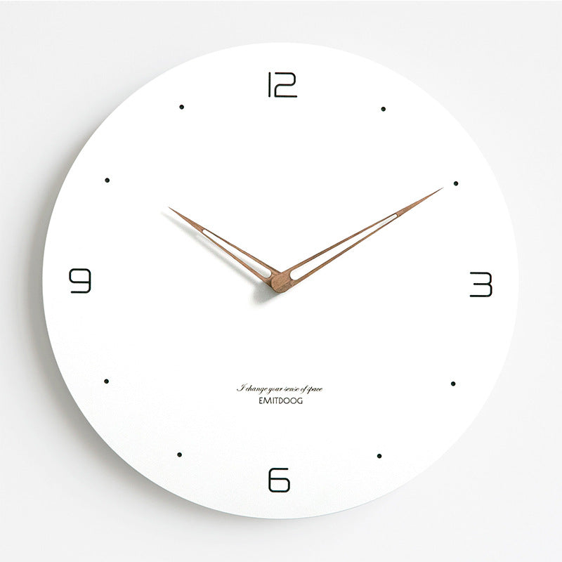 Stylish quartz wall clock hanging on wall