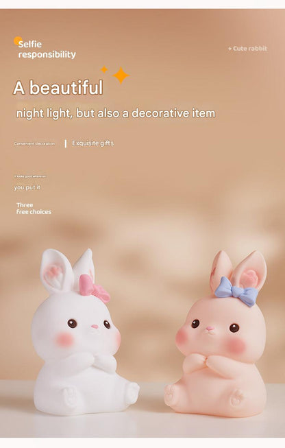 Kids enjoying colorful bunny-shaped LED lamp