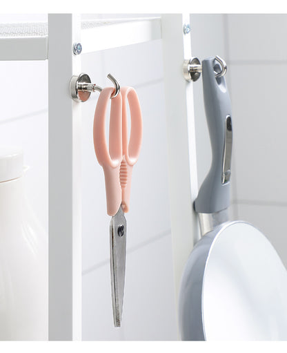 Magnetic hook holding kitchen utensils